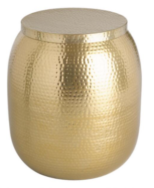 A side table featuring a gold metal design.
